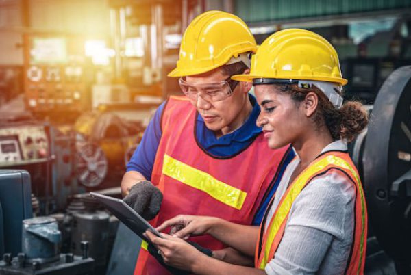 two-industrial-workers-discussing-image
